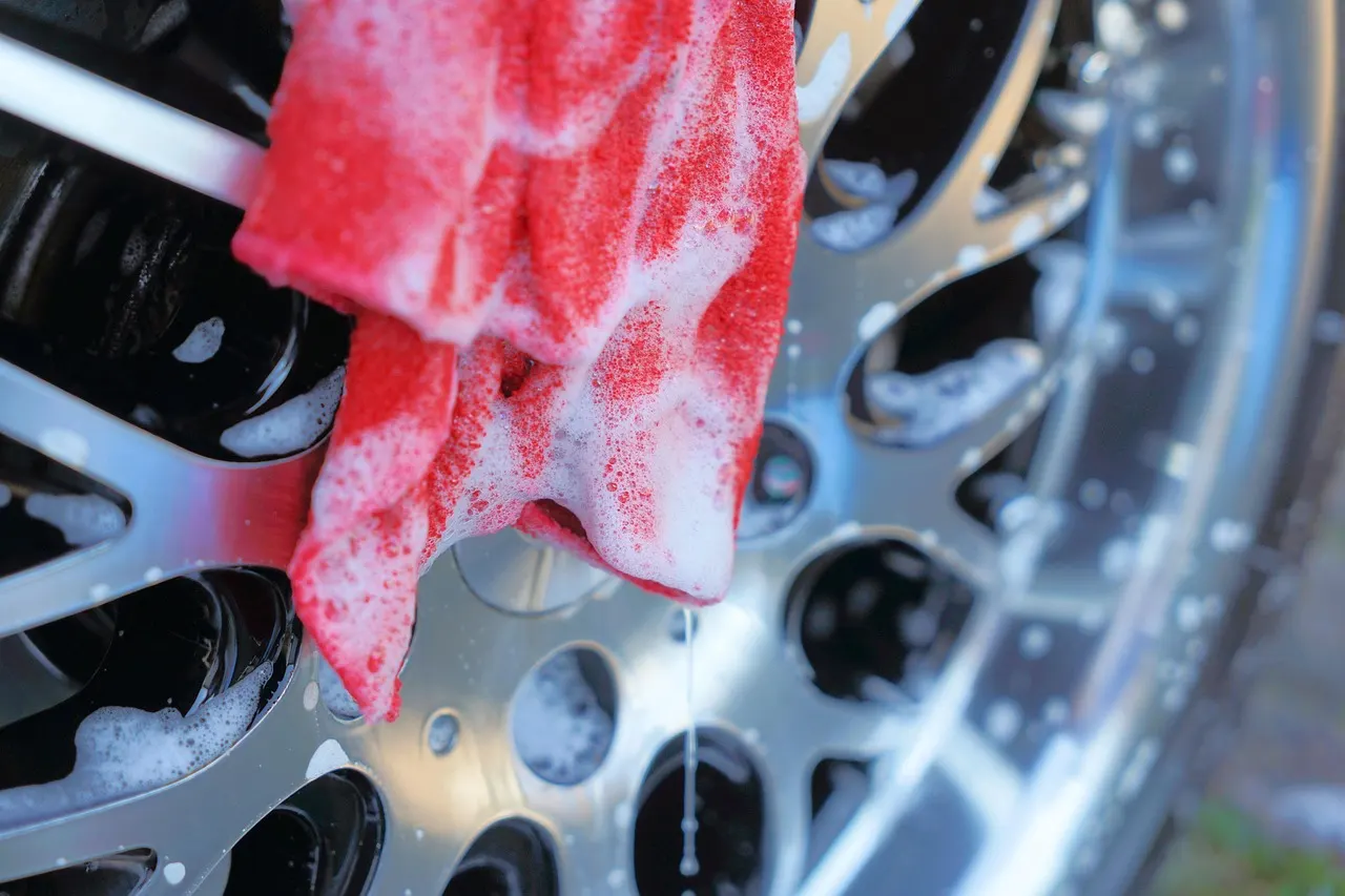 Car wheel being cleaned